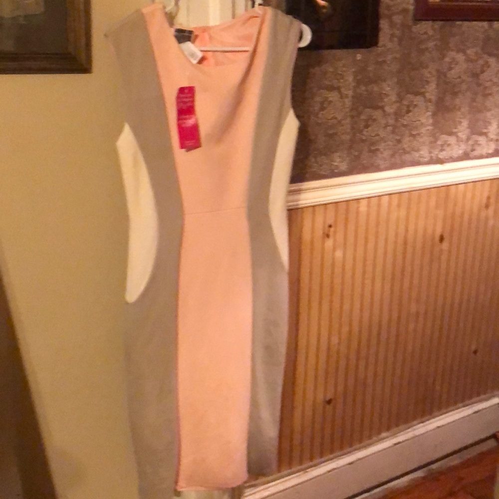 Medium dress w/tags hits below the knee